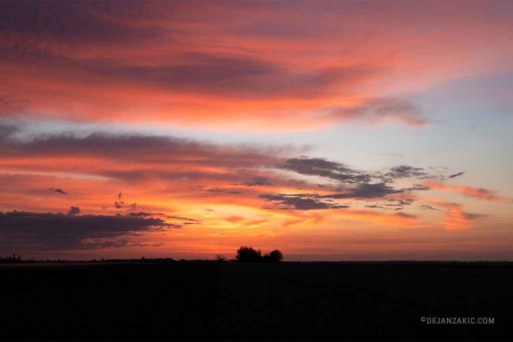 Vibrant sunrise over a rural landscape