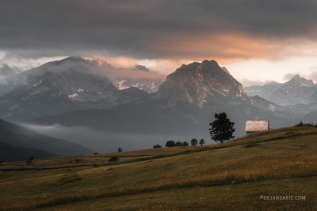 Mountain valley under dramatic clouds
